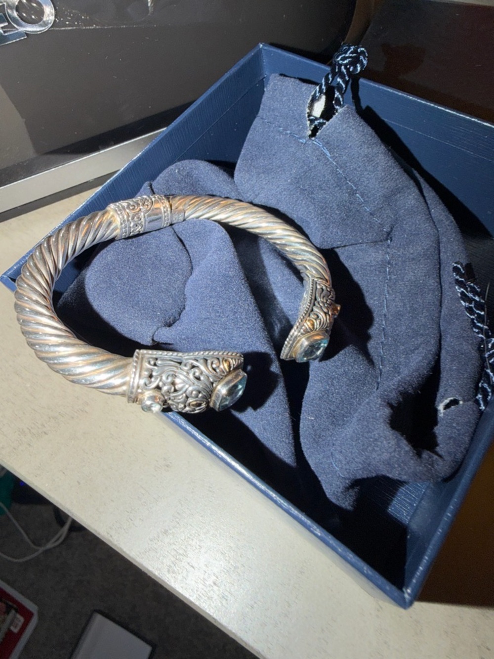 Silver-Tone Twisted Cuff Bracelet with Ornate End Caps